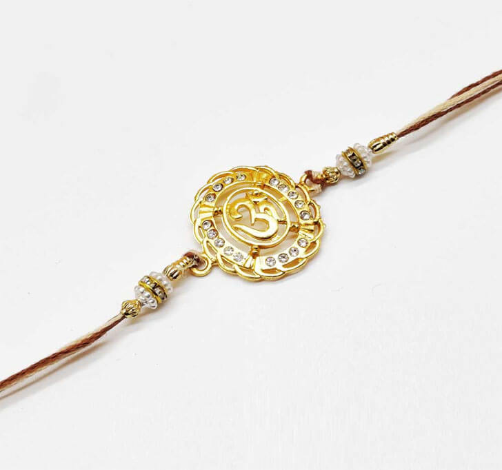 Buy Designer OM Diamond Stone Center Piece Bhaiya Rakhi