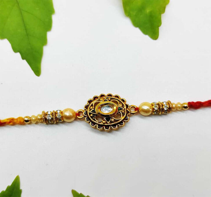 Golden Designer Diamond Stone Center Piece Bhaiya Rakhi