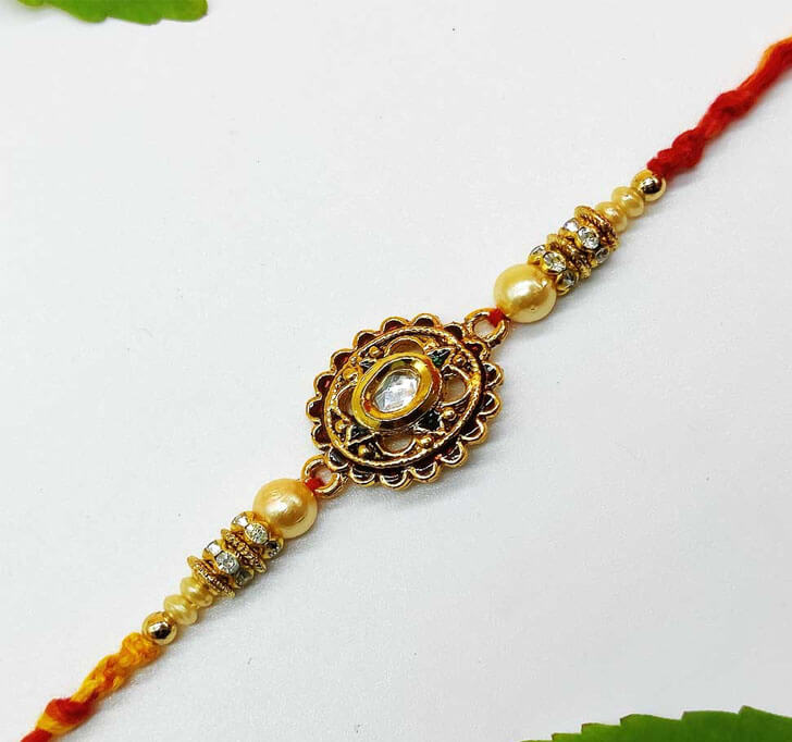 Buy Golden Designer Diamond Stone Center Piece Bhaiya Rakhi