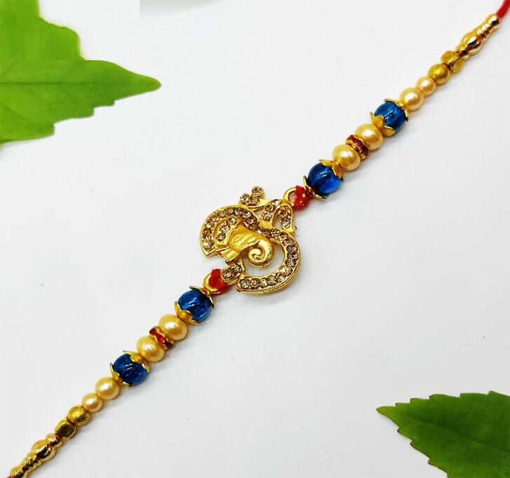 Buy Elephant OM Golden Designer Center Piece Bhaiya Rakhi