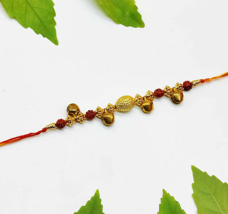 Buy Golden Ghungru Designer Center Piece Bhaiya Rakhi