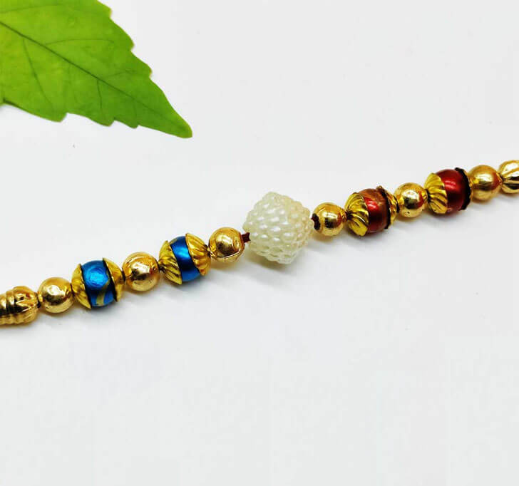 Golden Beads White Pearl Center Piece Bhaiya Rakhi